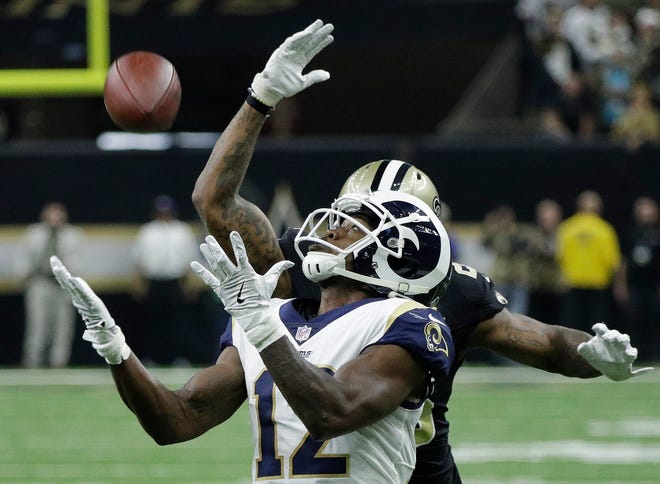 Los Angeles Rams wide receiver Brandin Cooks prepares to make a catch ahead of New Orleans Saints cornerback P.J. Williams during the first half of the NFL football NFC championship game, Sunday, Jan. 20, 2019, in New Orleans. (AP Photo/David J. Phillip)