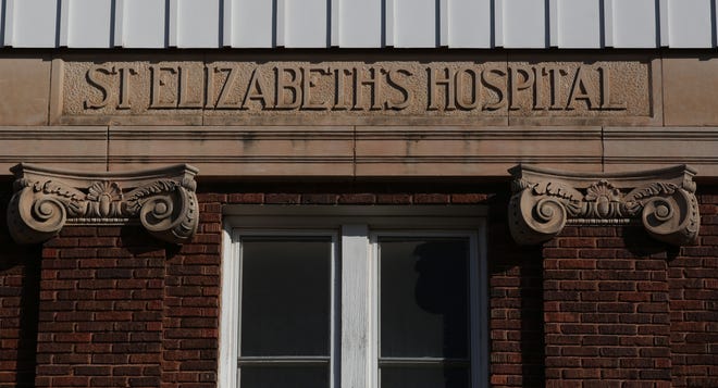 The St. Elizabeth's Hospital name is still located on the older portion of the building in the file photo from Feb. 19, 2018. The hospital, at the corner of West 20th Ave. and Monroe St., has been gifted to Interfaith Housing Services, which plans to renovate it into low income apartments. [Sandra J. Milburn/HutchNews file]