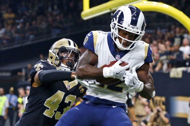 Los Angeles Rams wide receiver Brandin Cooks (right) pulls in a touchdown reception in the NFC Championship game. Cooks was dealt in a trade to the Rams last year by the New England Patriots. [AP File Photo/Butch Dill]
