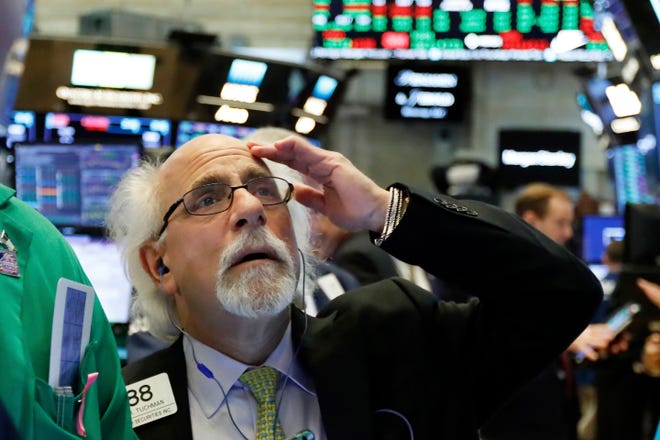 Trader Peter Tuchman works on the floor of the New York Stock Exchange on Tuesday. Stocks posted an uneven finish on Wall Street, handing the S&P 500 index its second decline in a row. [AP Photo / Richard Drew]
