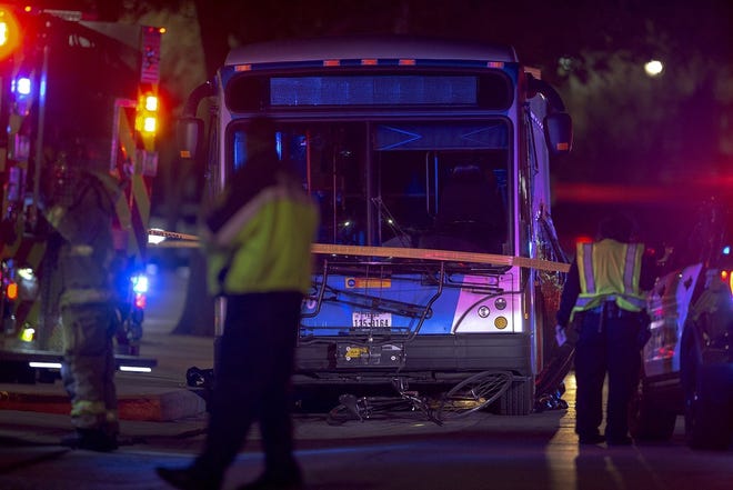 Authorities work the scene on the University of Texas campus early Tuesday where a Capital Metro bus struck and killed a man along San Jacinto Boulevard near 22nd Street the night before. [NICK WAGNER/AMERICAN-STATESMAN]