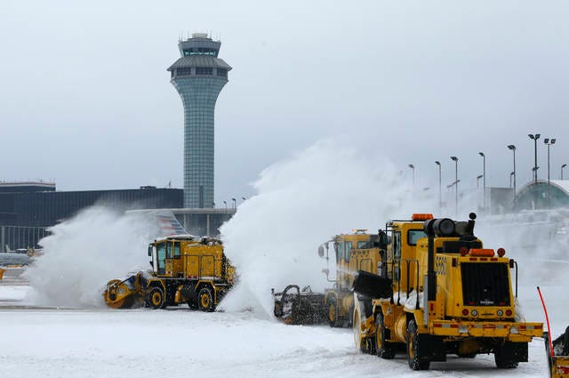 Snowplows clear snow along runways and the tarmac at Chicago O’Hare International Airport on Monday. One Wednesday, temperatures over that snow hit wind chill factors of 50 degrees below zero. (Stacey Wescott/Chicago Tribune)