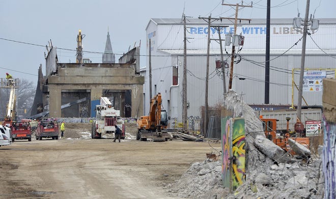 Demolition continues on the former McBride Viaduct. The city of Erie and other defendants want a court appeal over the bridge's demolition quashed, saying the issue is now moot beause most of the bridge has been razed. [GREG WOHLFORD/ERIE TIMES-NEWS]