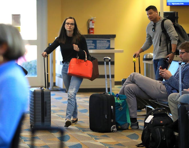 Passengers walk through the terminal at the Gainesville Regional Airport after disembarking a flight from Miami to Gainesville on Tuesday. The Gainesville airport saw significant growth in 2019. [Brad McClenny/Staff photographer]