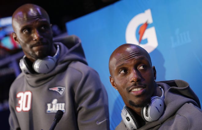 New England Patriots' Jason McCourty and Devin McCourty answer questions during Opening Night for the NFL Super Bowl 53 football game in Atlanta. (AP Photo/David Goldman)