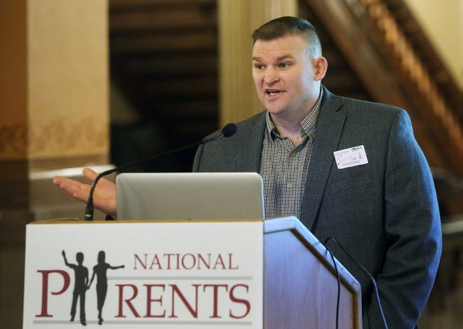 Will Mitchell, chairman of the Kansas chapter of the National Parents Organization, talks about faimily court reform during an event Thursday at the Statehouse. [Thad Allton/The Capital-Journal]