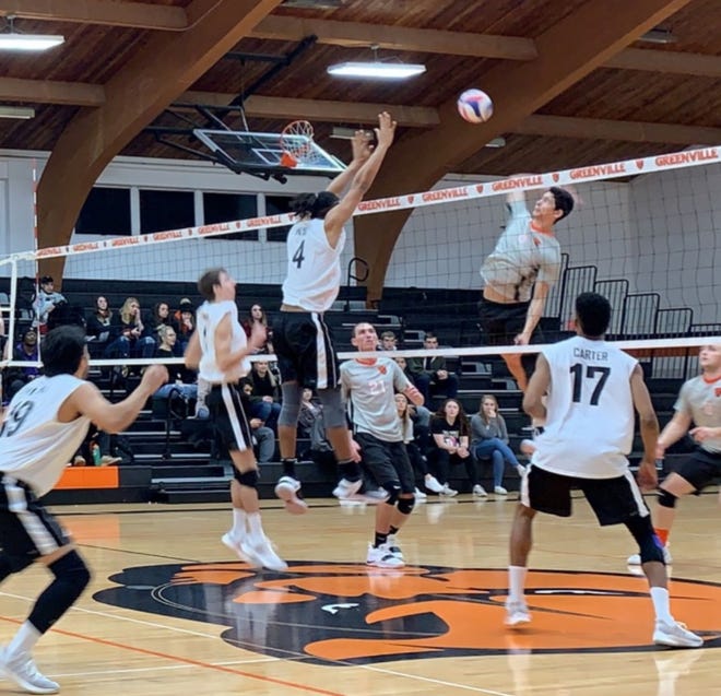 Lincoln College middle hitter Michael Wesley, of Chicago, blocks a shot during the match against Greenville. [Photo submitted]