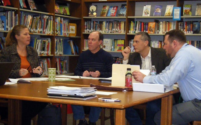 From left, Kensington School Board Chair Jen Ramsey chats with members Jon Lavelle and Tim Galitski and SAU 16 Assistant Superintendent Chris Andriski at the budget public hearing held Jan. 9. [Photo by Kathleen Bailey]