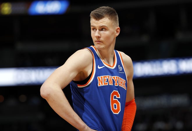 FILE - In this Jan. 25, 2018, file photo, New York Knicks forward Kristaps Porzingis, of Latvia, reacts after fouling out during the second half of the team's NBA basketball game against the Denver Nuggets on Thursday,, in Denver. The Knicks agree to trade injured star Kristaps Porzingis to Dallas Mavericks on Thursday, Jan. 31, 2019. (AP Photo/David Zalubowski, File)