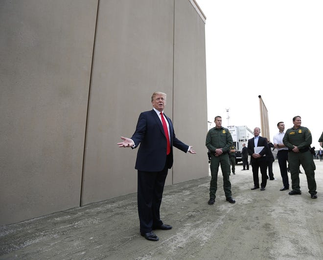 President Donald Trump tours the border wall prototypes near the Otay Mesa Port of Entry in San Diego County, California, on March 13, 2018. [K.C. Alfred/San Diego Union-Tribune file via TNS]