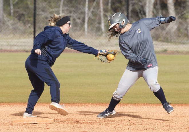 Gulf Coast State College's Rachael Reeves and Hayden Lindsay practice softball on Wednesday, January 30, 2019. [JOSHUA BOUCHER/THE NEWS HERALD]