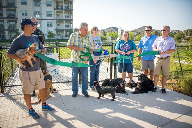 City Parks Director James Hemenes is leaving the city after five years of service. Pictured: Hemenes, second from right, joins Mayor Victor Gonzales, center, and others in a ribbon cutting on July 22 to officially open Stone Creek Dog Park. [File photo, Megumi Rooze]