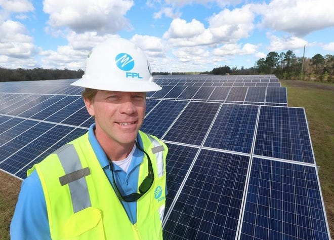 Florida Power & Light Project Manager Geoff West stands in front of some of the more than 300,000 solar panels at the utility’s Pioneer Trail Solar Energy Center near Samsula. [News-Journal/David Tucker]