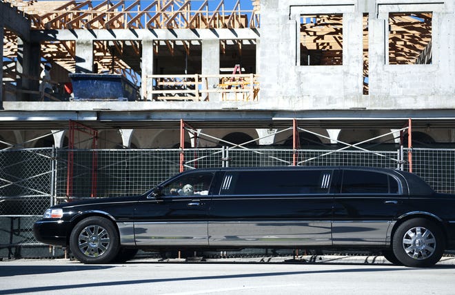 A dog peers out the front window of a limousine parked in front of the Testa's site Tuesday. The Frisbie Group is redeveloping the 1.3-acre site. [Photos by Meghan McCarthy/palmbeachdailynews.com]