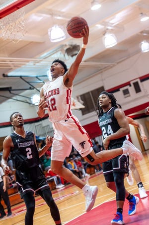 Seventy-First's Trevon Bell scores against Lumberton at Seventy-First on Friday, February 1, 2019. Seventy-First won 83-69. [Raul F. Rubiera/The Fayetteville Observer]