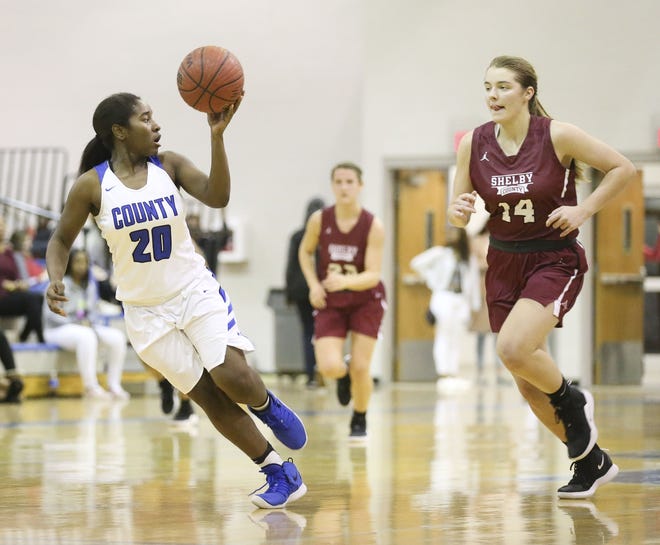 Tuscaloosa County's Kaylyn Colver runs away from Shelby County's Maggie West in the regular-season finale on Friday. [Staff Photo/Gary Cosby Jr.]