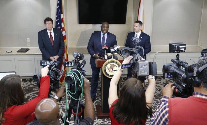 Alabama's three U.S. attorneys announce increased federal involvement in the shootings of police officers Friday, Feb. 1, 2019, at Hotel Capstone. Louis V. Franklin Sr., U.S. attorney for Alabama's middle district, speaks at the news conference, flanked by southern district attorney Richard W. Moore, left, and northern district attorney Jay E. Town. [Staff Photo/Gary Cosby Jr.]