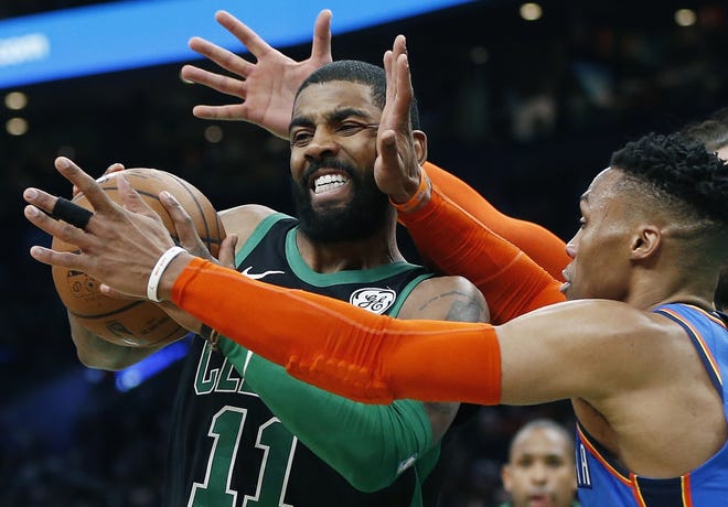 Boston's Kyrie Irving (left) tries to get by Oklahoma City Thunder's Russell Westbrook during the first half of the Celtics' win on Sunday at TD Garden. [AP Photo/Michael Dwyer]