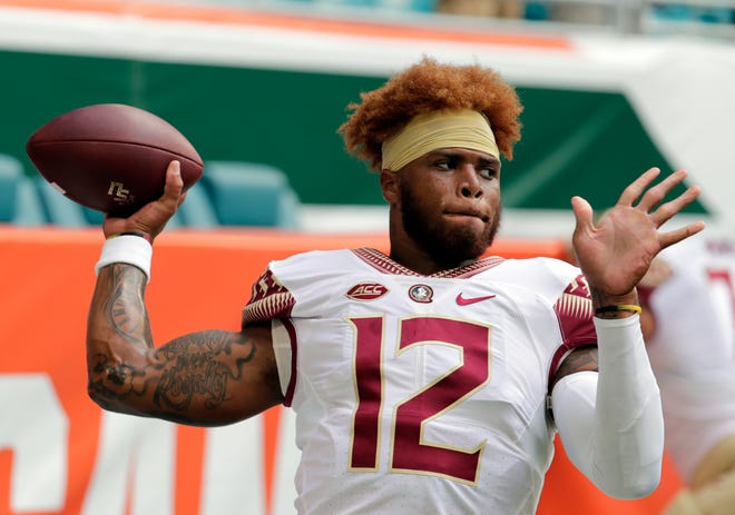 Florida State quarterback Deondre Francois warms up before a game against Miami on Oct. 6, 2018. Florida State head coach Willie Taggart announced Sunday that Francois has been dismissed from the team [Lynne Sladky/The Associated Press]