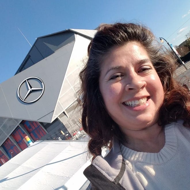 Patty King Hester takes a selfie outside Atlanta’s Mercedez-Benz Stadium. The Panama City Beach resident is a veteran member of the Super Bowl's halftime field crew. [CONTRIBUTED]