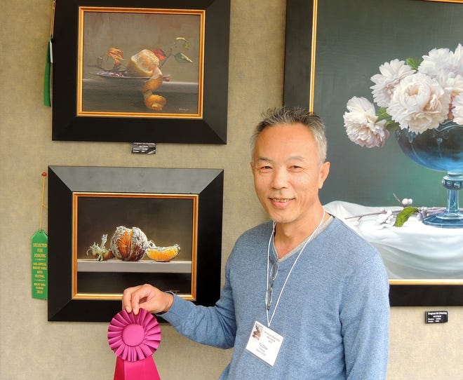 Yu Zhou of Yadley, Pennsylvania was awarded Best in Show for his paintings at the Mount Dora Arts Fest this weekened. [SUBMITTED]
