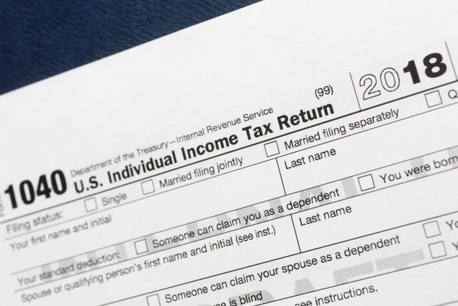File photo shows a portion of the 1040 U.S. Individual Income Tax Return form for 2018 in New York. [AP PHOTO/MARK LENNIHAN]