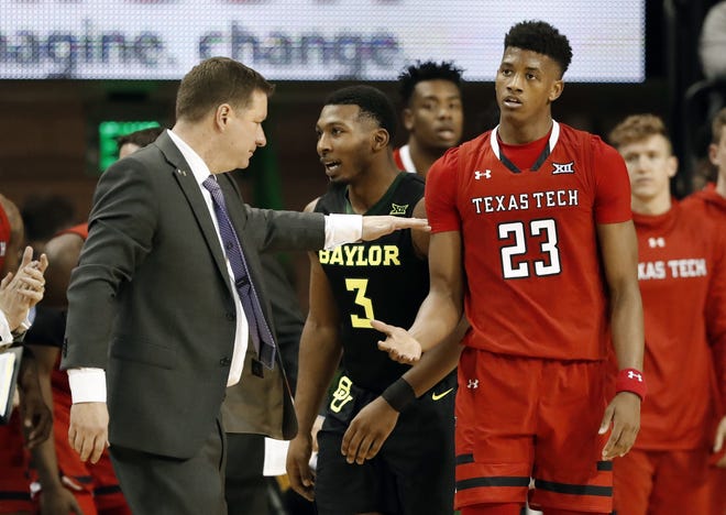 Texas Tech head coach Chris Beard, left, greets Jarrett Culver (23) during a timeout during the Red Raiders' Jan. 19 game at Baylor. Culver is among the 10 remaining candidates for the Jerry West Award that goes to the nation's top shooting guard. [AP Photo/Tony Gutierrez]