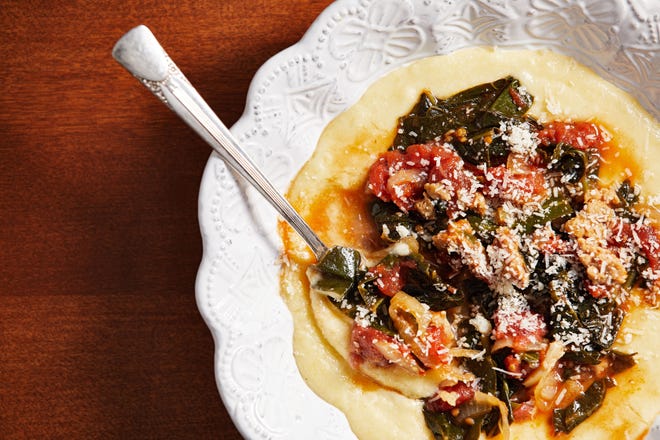 Braised collard greens are transformed into a main course by adding Italian sausage and serving them over polenta. [TOM McCORKLE/THE WASHINGTON POST]