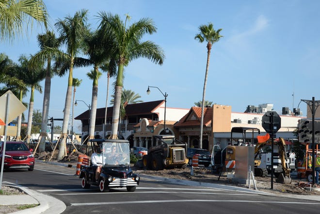 Workers from Quality Enterprises USA installed 10 palm trees along the median of the 100 block of West Venice Avenue on Monday and Tuesday, as part of the downtown road reconstruction project. [HERALD-TRIBUNE STAFF PHOTO / EARLE KIMEL]