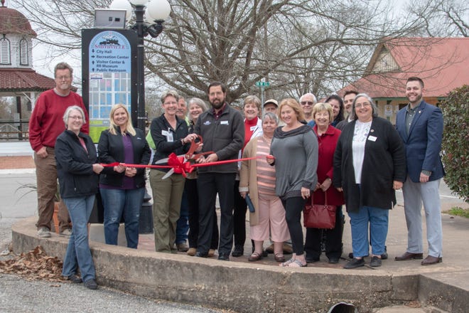 The Smithville Chamber of Commerce held a ribbon cutting for the new downtown wayfinding sign kiosks. [CONTRIBUTED PHOTO]