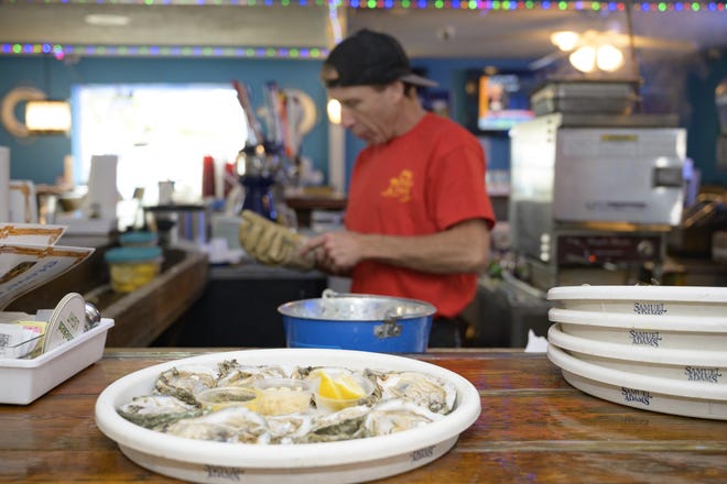 The oyster bar allows customers the experience of seeing their oysters shucked fresh in front of them by oyster shucker James "Jimbo" Pietro, who worked at the original Steve's Place. [Cindy Sharp/Correspondent]