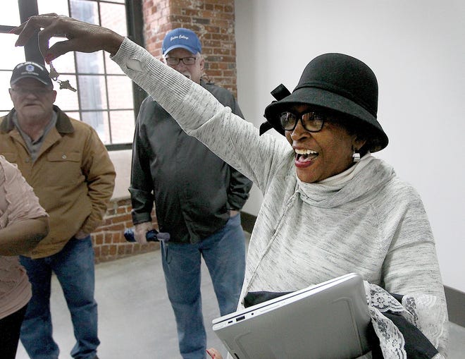 Dot Guthrie proudly displays the keys to the African American Museum of History and Culture that is being started on the second floor in the Loray Mill. [JOHN CLARK/THE GASTON GAZETTE]