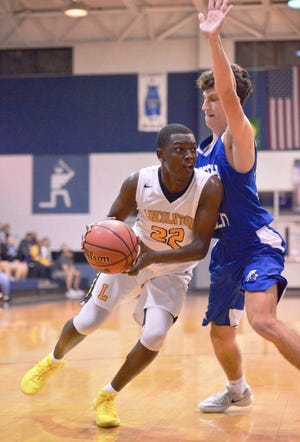 Kris Robinson drives to the basket in a game against North Lincoln earlier this season. [Lincoln Times-News photo]