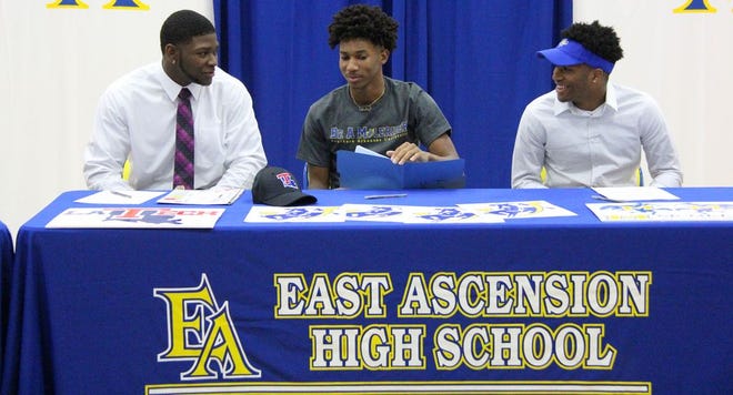 From left to right, Deshon Hall signed with Louisiana Tech, Shaivonn Robinson signed with Southern Arkansas and Markquell Stewart signed with McNeese State. Photos by Kyle Riviere.