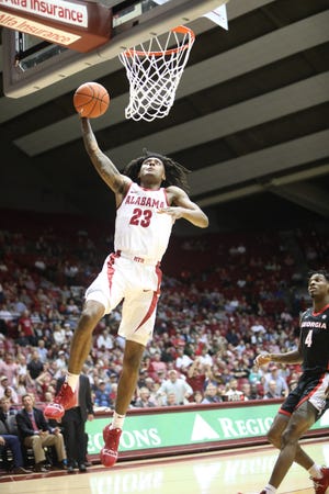 Alabama guard John Petty goes up for a dunk during the Crimson Tide's game with the Georgia Bulldogs on Wednesday at Coleman Coliseum. [Photo/Joe Will Field]