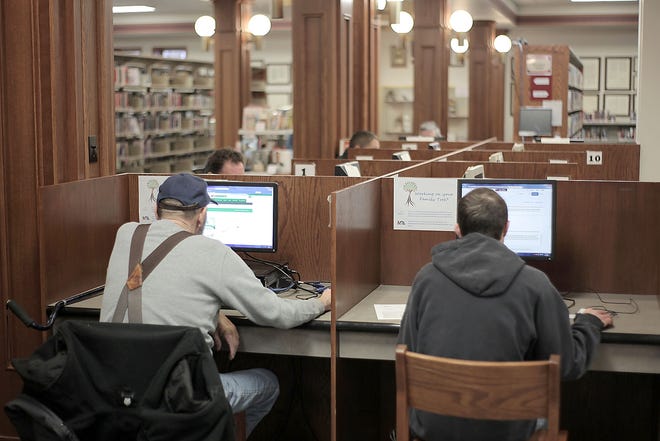 Hillsdale residents use the public access computers at Hillsdale's Community Library on Wednesday. A city-owned fiber optic network has been proposed, which would increase residential internet speeds. [SAM FRY/Hillsdale Daily News Photo]