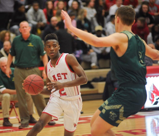 Pocono Mountain East's Triston Hilliman, left, drives to the lane against Emmaus. The third-seeded Cardinals host No. 6 Allen in the EPC boys basketball quarterfinals on Friday night. [POCONO RECORD FILE PHOTO]