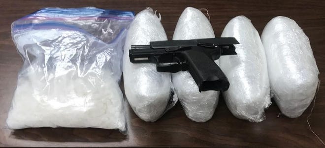 Seized methamphetamine valued over $156,000 dollars and one handgun.