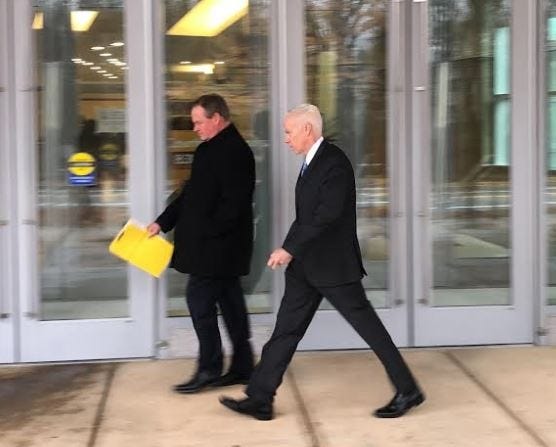 Providence Police Lt. Joseph Donnelly, right, leaves Kent County District Court with his lawyer, William Murphy. [The Providence Journal / Brian Amaral]