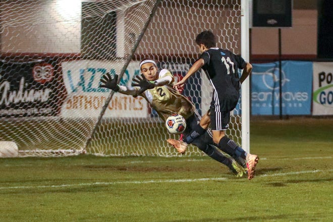 Paxon goalie Ryder Matthews denies Ponte Vedra's Henry Carpenter during the first half of Wednesday's Region 1-3A quarterfinal contest. Minutes later Carpenter scored Ponte Vedra's third goal. The Sharks won 4-0. [WILL BROWN/THE RECORD]