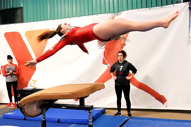 Sandy Valley's Regan Finnicum completes a vault during the conference meet at Wooster High School. Finnicum placed 10th in all-around.