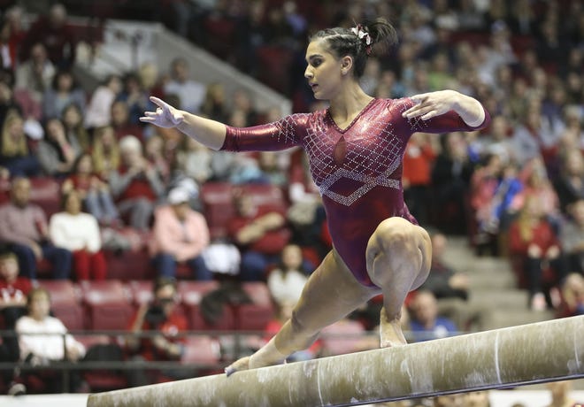 Alonza Klopfer does her routine on the balance beam in the Crimson Tide's meet with LSU in Coleman Coliseum on Friday, Jan. 25, 2019. [Staff Photo/Gary Cosby Jr.]