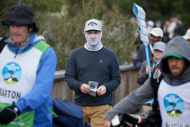 Matt Every makes his way across a bridge after hitting a tee shot during the third round of the AT&T Pebble Beach (California) Pro-Am on Saturday. [Associated Press/Eric Risberg]
