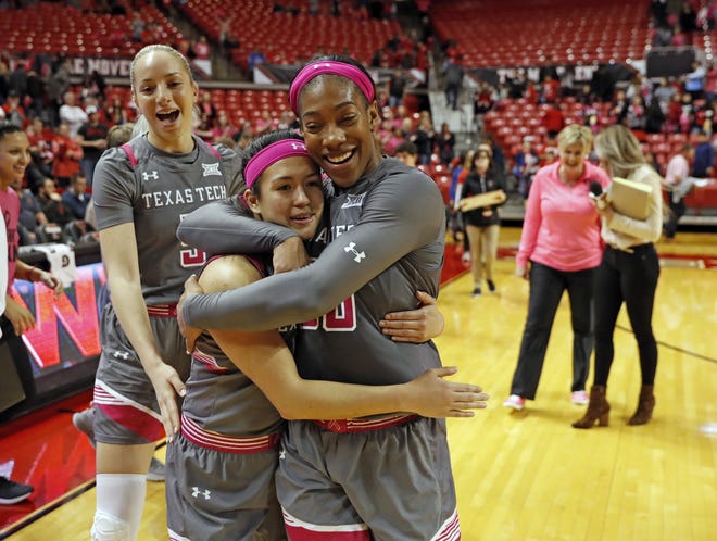 Texas Tech's Mia Castaneda (0) and Zuri Sanders (30) celebrate Saturday after defeating Oklahoma State 90-78, snapping an eight-game losing streak. Sanders finished with eight points, 12 rebounds, six assists and five steals in the victory at United Supermarkets Arena. [Brad Tollefson/A-J Media]
