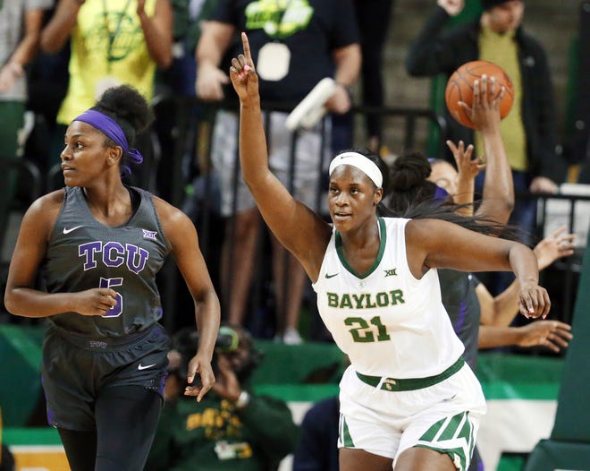 Baylor center Kalani Brown, right, reacts to her score while heading up court with TCU forward Yummy Morris, left, in the first half of an NCAA college basketball game, Saturday, Feb. 9, 2019, in Waco, Texas. (AP Photo/Rod Aydelotte)