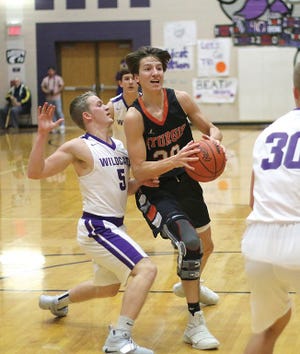 Thomas Kurowski of Sturgis heads in for a shot against Three Rivers in prep basketball action on Friday night.