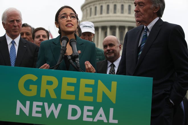Rep. Alexandria Ocasio-Cortez, D-N.Y., speaks as Sen. Ed Markey, D-Mass., right, and other Congressional Democrats listen during a news conference in front of the U.S. Capitol on Thursday, Feb. 7, 2019, in Washington. [TNS file]