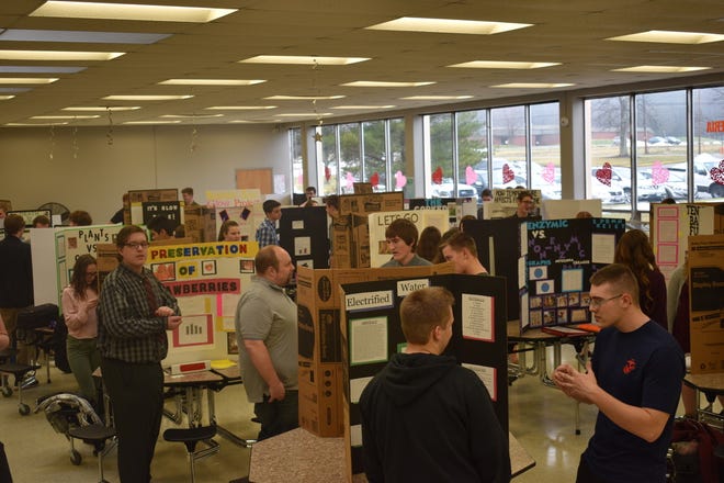 Students and judges move around the Marlington High School cafeteria during the school's 7th annual Science Fair.