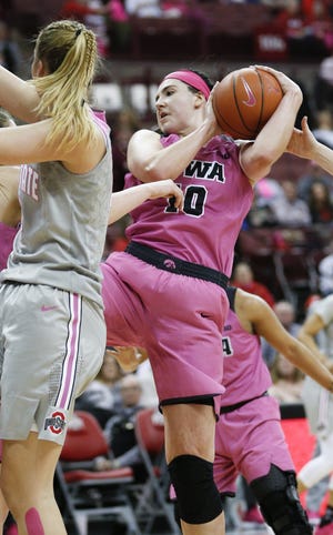 Iowa's Megan Gustafson pulls down a rebound during the third quarter. She finished with 29 points and 15 rebounds. [Joshua A. Bickel/Dispatch]