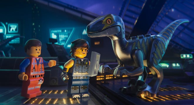 This image released by Warner Bros. Pictures shows the characters Emmet, left, and Rex Dangervest, center, both voiced by Chris Pratt, in a scene from "The Lego Movie 2: The Second Part." [Warner Bros. Pictures via AP]